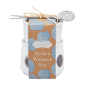 Butter warmer set with packaging featuring blue shell pattern on a white background