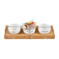 Three bowls are neatly arranged in a box alongside a greeting card.