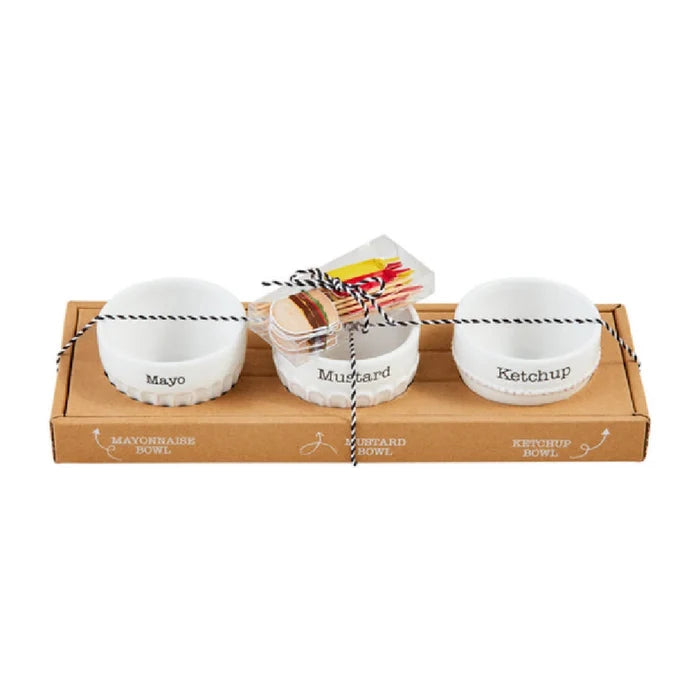 Three bowls are neatly arranged in a box alongside a greeting card.