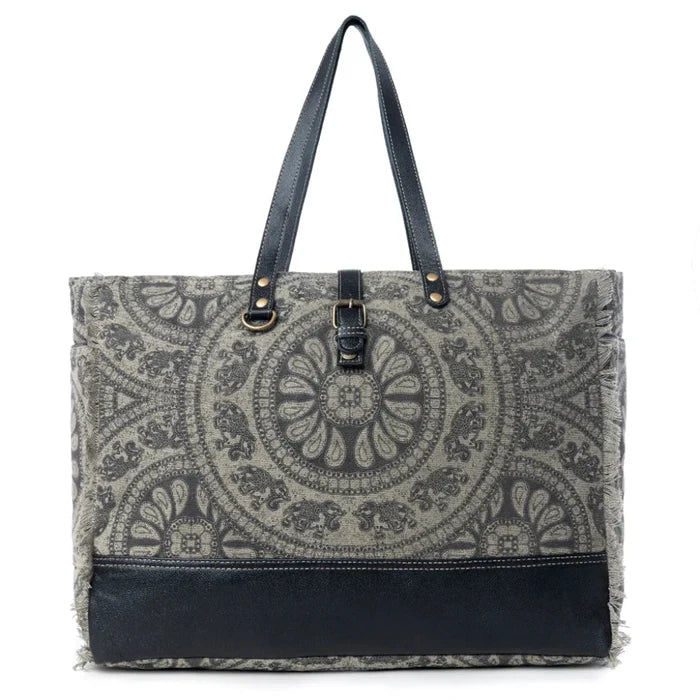 This Myra Carmela Weekender Bag brings together vintage Western charm and practical travel style