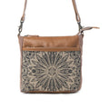 This compact Myra Bag Dizzy Circle Small & Crossbody bag features a bold circular silhouette that stands out in any crowd