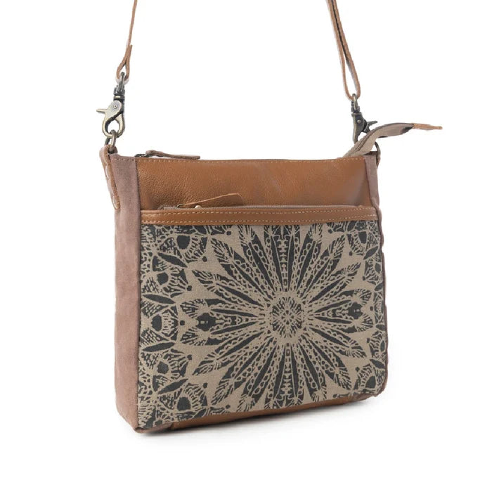 This compact Myra Bag Dizzy Circle Small & Crossbody bag features a bold circular silhouette that stands out in any crowd