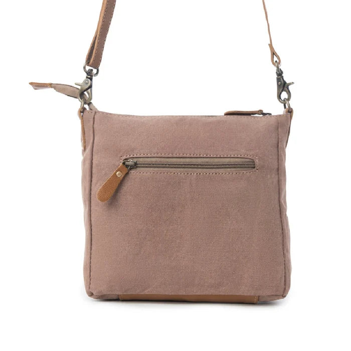 This compact Myra Bag Dizzy Circle Small & Crossbody bag features a bold circular silhouette that stands out in any crowd