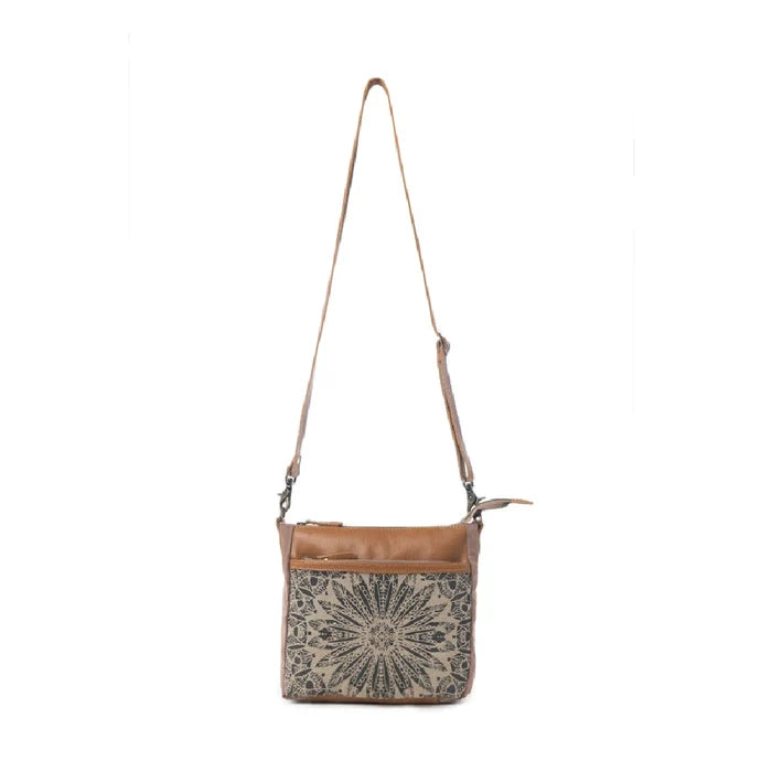 This compact Myra Bag Dizzy Circle Small & Crossbody bag features a bold circular silhouette that stands out in any crowd