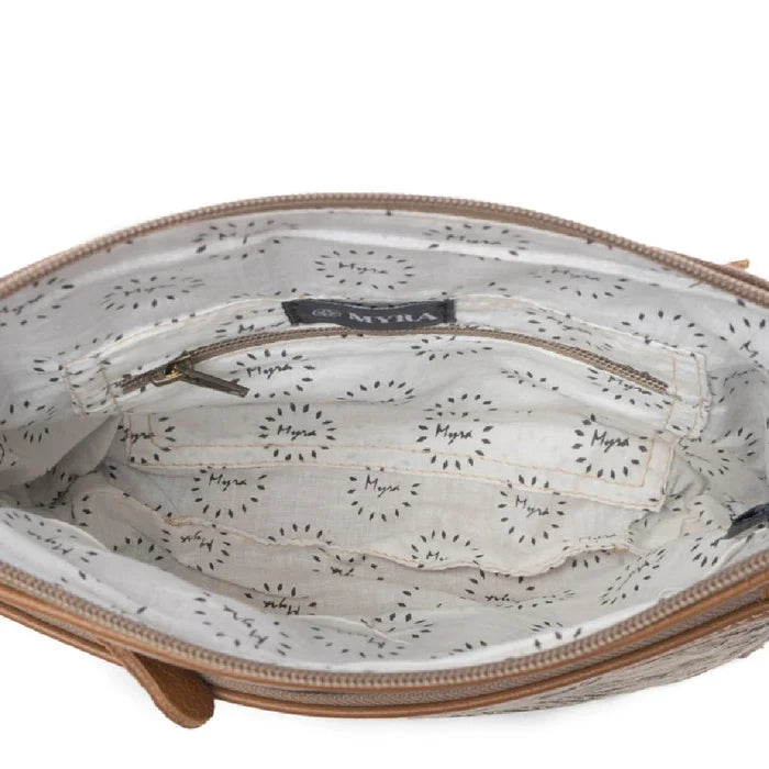 This compact Myra Bag Dizzy Circle Small & Crossbody bag features a bold circular silhouette that stands out in any crowd