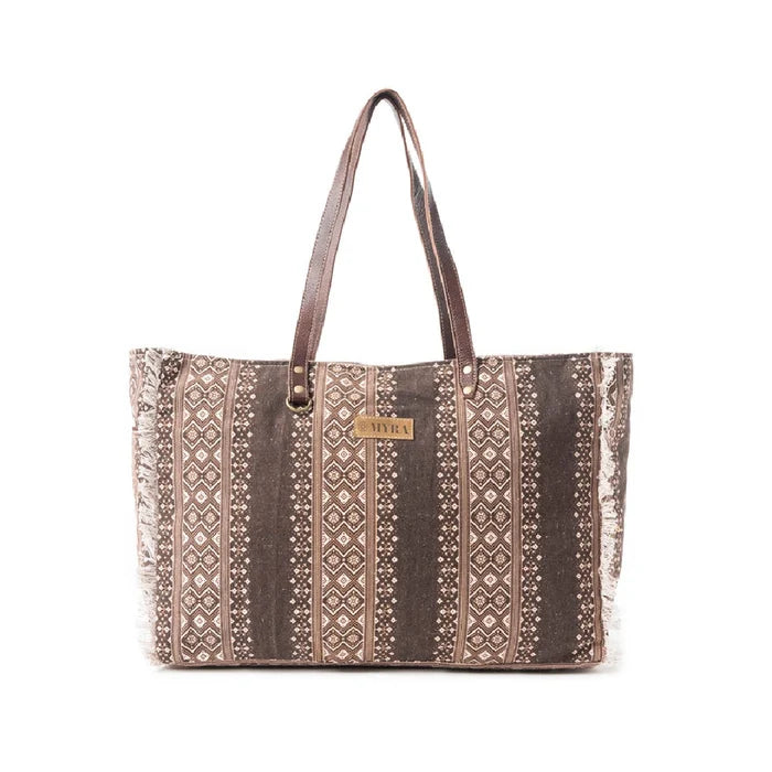 A brown and white tote bag featuring a stylish patterned design, ideal for casual outings or shopping trips.