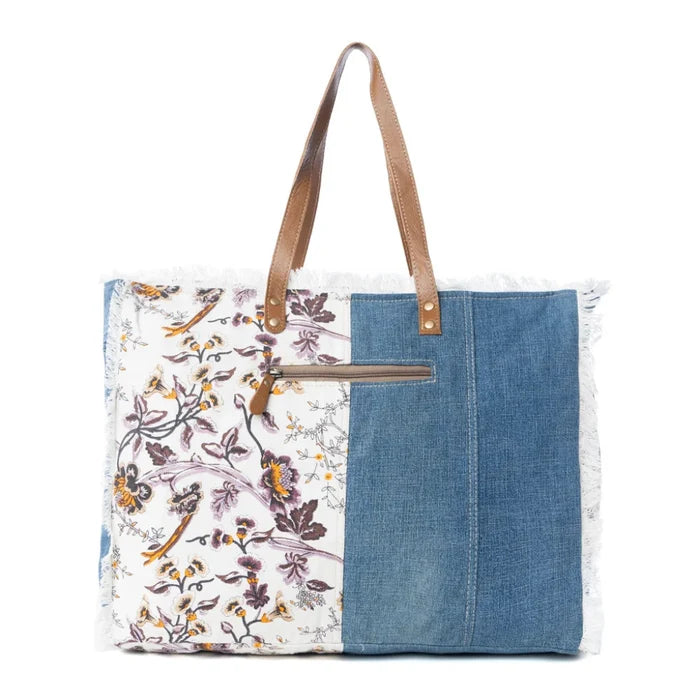 This Myra Bag Venture Weekender Bag features a vintage paisley-inspired printed canvas body in neutral gray tones.