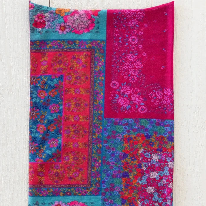 A vibrant pink boho bandana featuring unique designs, ideal for fashion-forward accessories.