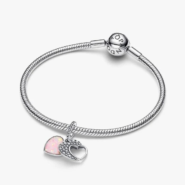 Elegant Pandora heart charm embellished with pink opal stones, perfect for adding a touch of color to any jewelry collection.