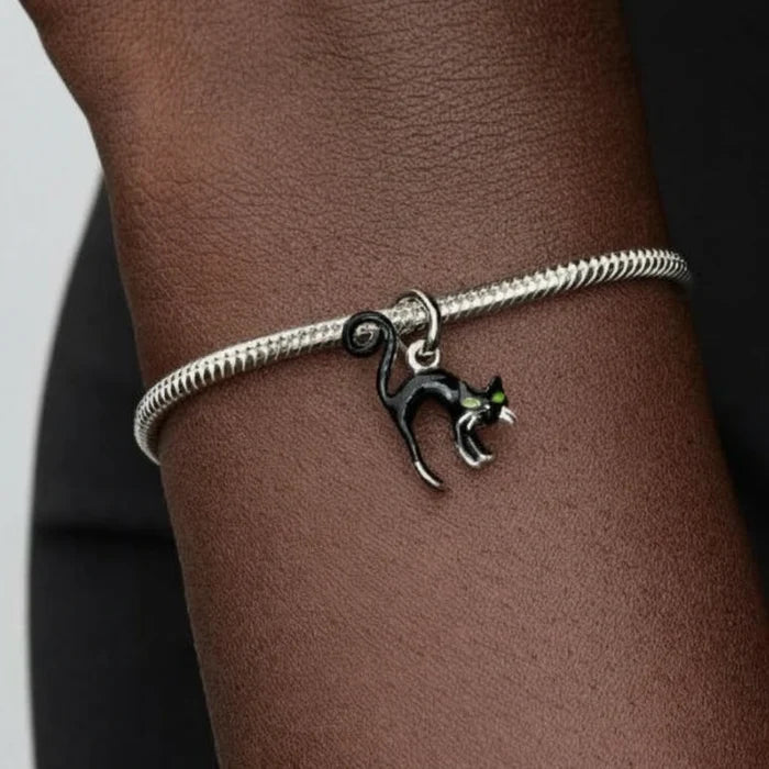 Pandora Black Cat dangle charm featuring an intricately detailed black cat with a polished finish, designed for PANDORA Moments bracelets and necklaces.