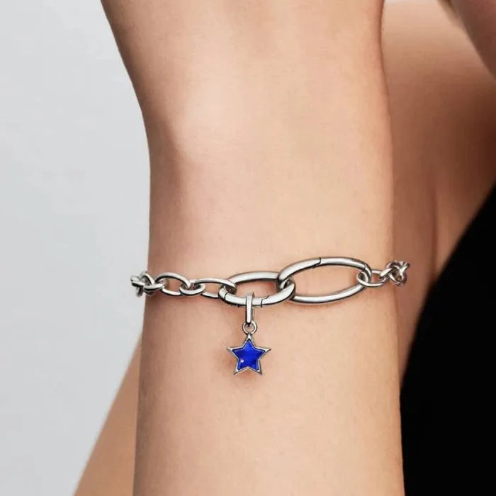 PANDORA Blue Star Mini Dangle Charm in sterling silver with a shimmering textured finish, designed as a delicate celestial star charm for PANDORA Moments bracelets and necklaces.