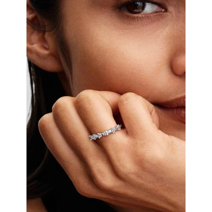 Pandora Bow Station Ring worn on finger, sterling silver bow ring with cubic zirconia sparkle on hand close-up