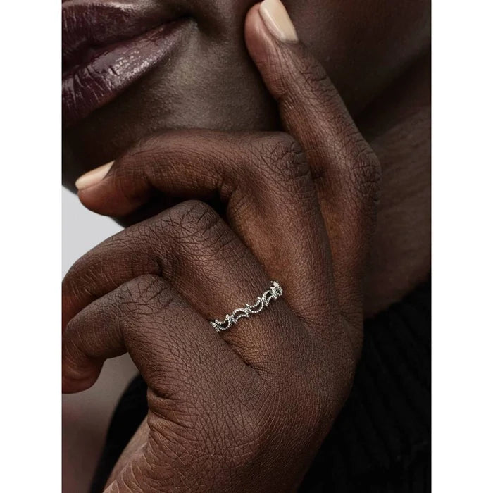 Pandora crescent moon ring worn on model’s finger in lifestyle fashion jewelry photo