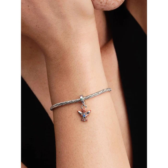 Gingerbread Angel Dangle Charm worn on a Pandora bracelet, shown on wrist for size and styling reference.