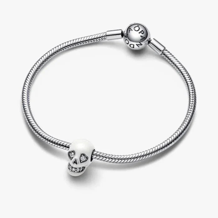 Pandora Glow-in-the-dark Sparkling Skull Charm featuring a detailed skull design with sparkling accents.