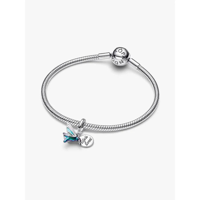 Pandora Hummingbird Double Dangle Charm displayed on sterling silver snake chain bracelet.