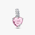 Pink heart charm featuring the phrase "I love you" elegantly inscribed on its surface.