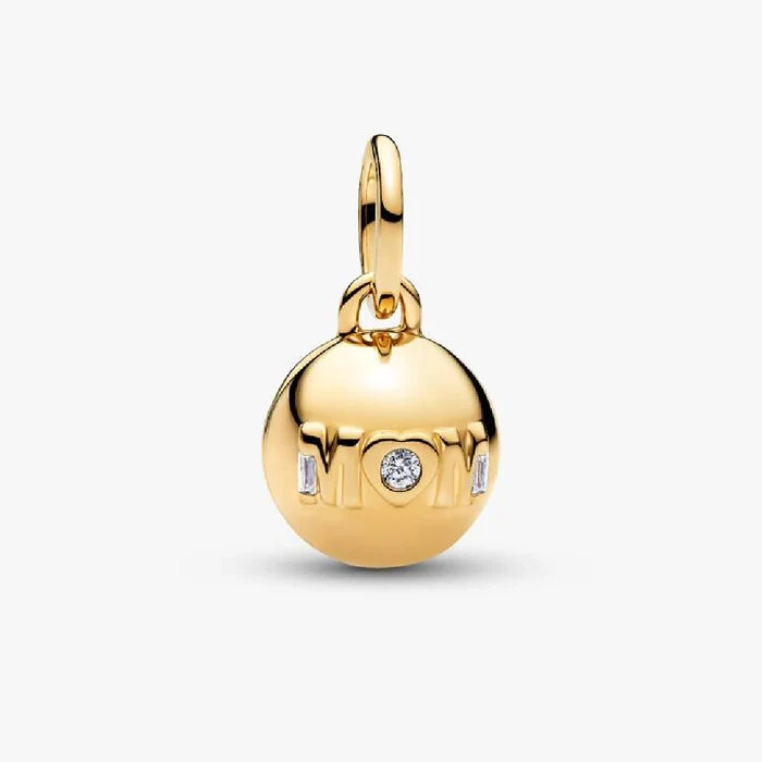 Gold "Mom" charm adorned with sparkling diamonds, showcasing a heartfelt tribute to motherhood.