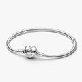 A silver bracelet featuring a heart charm, elegantly designed for a stylish accessory.