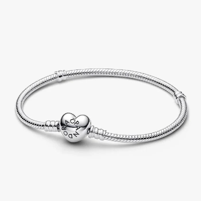 A silver bracelet featuring a heart charm, elegantly designed for a stylish accessory.