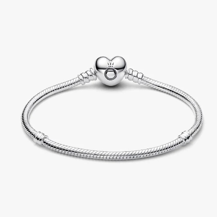 A delicate silver bracelet adorned with a charming heart pendant, perfect for any occasion.