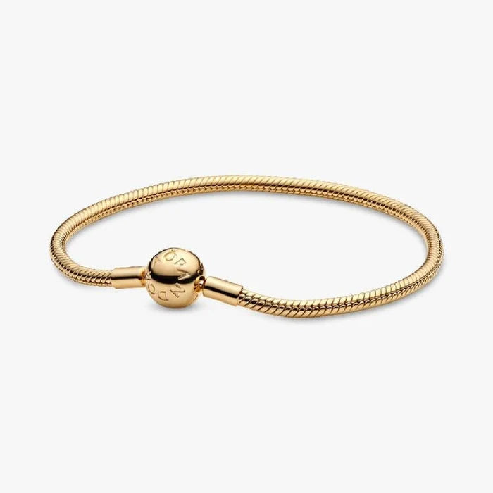 A gold-plated bracelet featuring a small decorative ball accent.