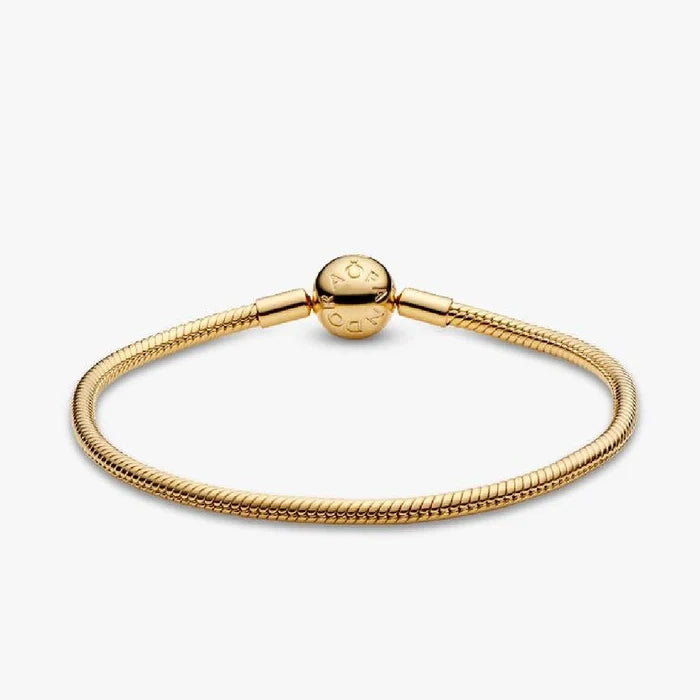 Elegant gold-plated bracelet adorned with a small ball detail.