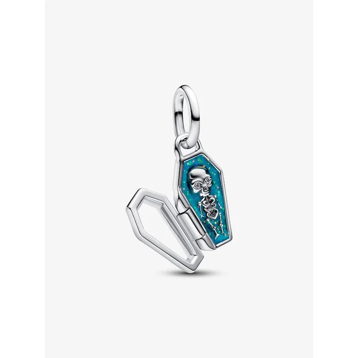 Close-up of Pandora coffin charm opened to reveal detailed skeleton design with blue enamel background.