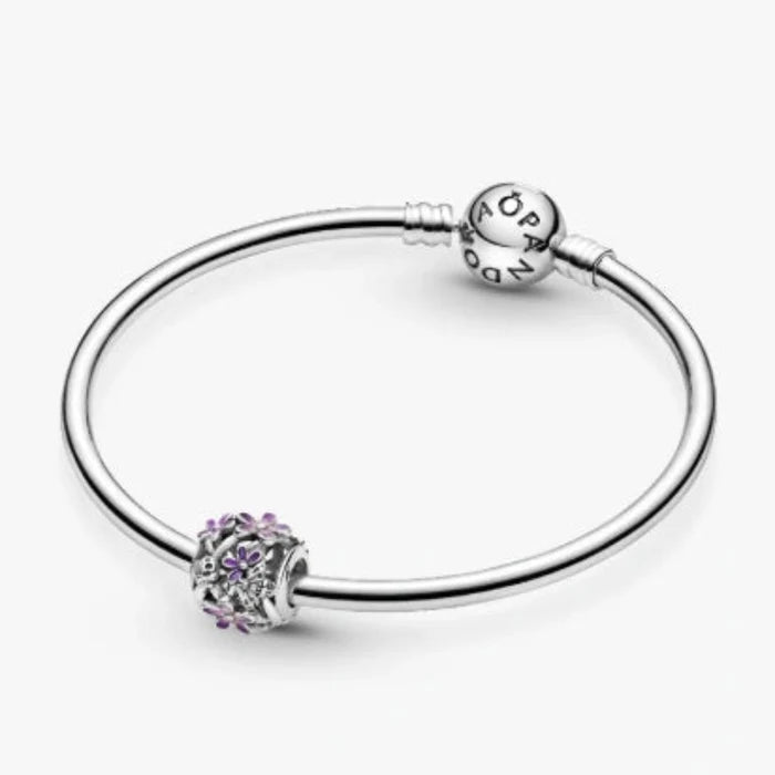 The Pandora Openwork Purple Daisy Charm features a delicate daisy design in rich purple tones.