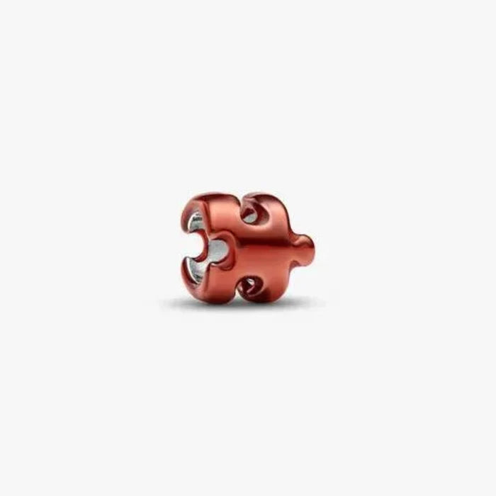 Orange Puzzle Piece Mini Charm featuring a vibrant puzzle piece