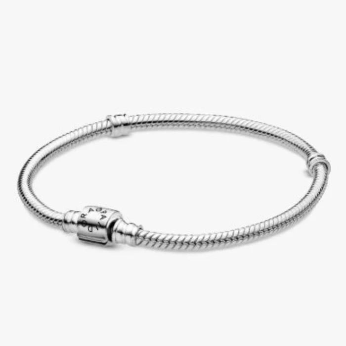 This Pandora Moments Barrel Clasp Snake Chain Bracelet offers a classic foundation for your favorite Pandora charms