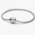 Pandora Moments Heart &amp; Snake Chain Bracelet featuring a polished snake chain with a heart-shaped clasp, designed for Pandora Moments charms and personalized jewelry.