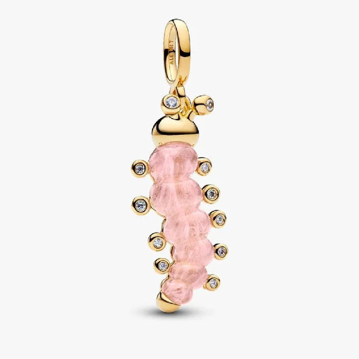 Pink stone charm adorned with diamonds, hanging from an elegant gold chain.