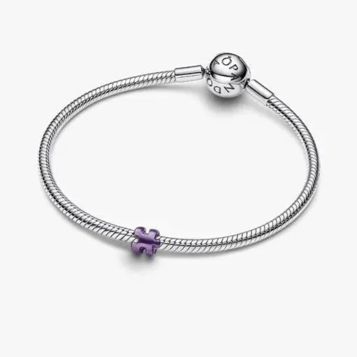 Purple Puzzle Piece Mini Charm featuring a vibrant purple puzzle piece design