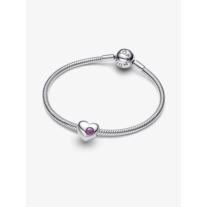 Close-up of Pandora Engravable Purple Stone Heart Charm on silver bracelet.