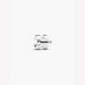 Silver puzzle piece charm on a light background