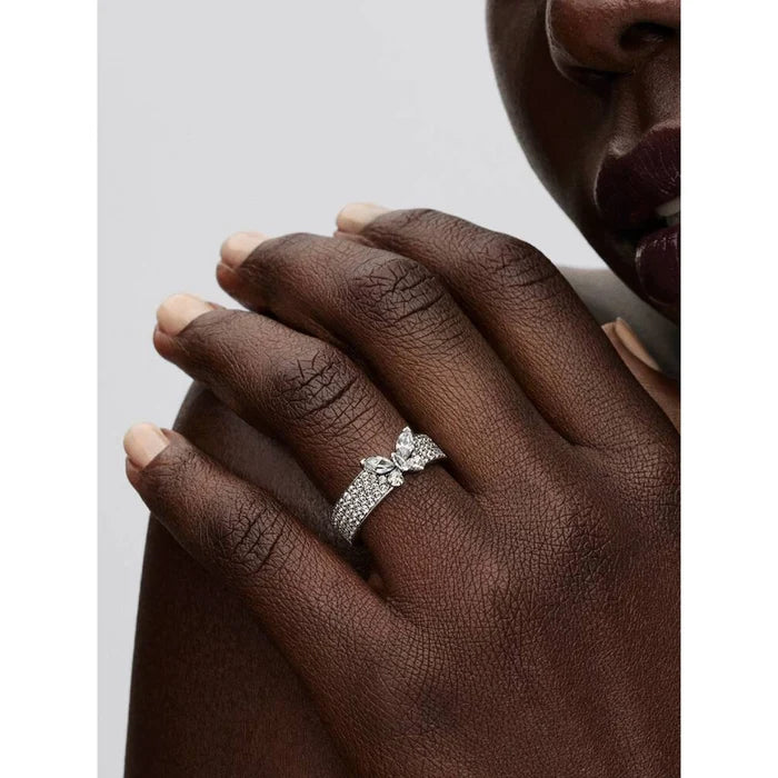Model wearing Pandora Sparkling Butterfly Bold Ring in silver on finger with butterfly and sparkling stones