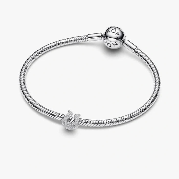 Pandora Textured Horseshoe Mini Charm in sterling silver with a detailed textured finish.