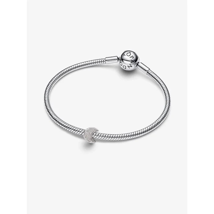 Pandora Textured Moon Mini Charm styled on a sterling silver snake chain bracelet with round Pandora clasp, shown on a white background.