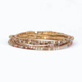 Periwinkle bracelet with six strands of blush, champagne, and AB crystals in a sparkling layered design.