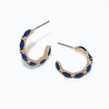 Periwinkle gold hoop earrings with faceted navy accents and a polished, elegant design.