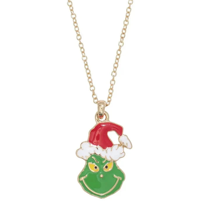 This Periwinkle Grumpy Green Christmas Necklace features a whimsical, grumpy holiday character rendered in vibrant green enamel