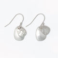 Hammered and polished silver layered earrings with a modern textured design