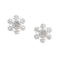 Periwinkle silver snowflake earrings featuring sparkling crystal centers and a festive winter design for holiday looks.