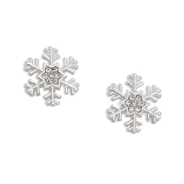 Periwinkle silver snowflake earrings featuring sparkling crystal centers and a festive winter design for holiday looks.