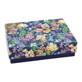 A blue box featuring a floral pattern, adding a touch of nature to its appearance.