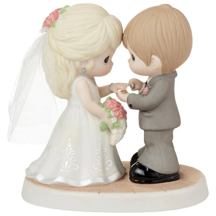 Romantic wedding figurine featuring a beautifully detailed bride and groom.