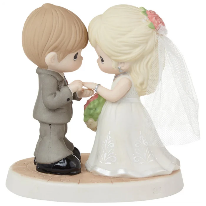 Romantic wedding figurine featuring a beautifully detailed bride and groom.