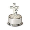 A silver cross and a small figurine displayed on an elegant silver platter.