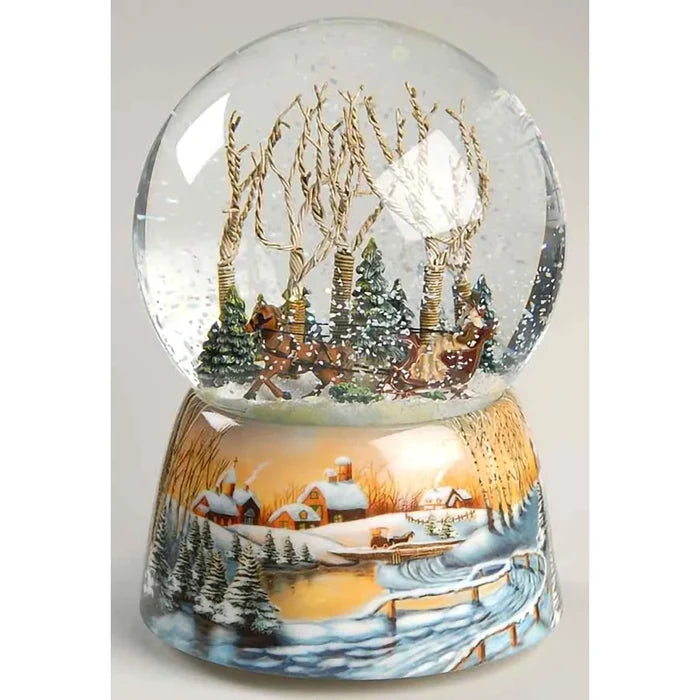 wind-up musical glitter dome featuring a charming winter scene surrounded by sparkling swirling glitter.